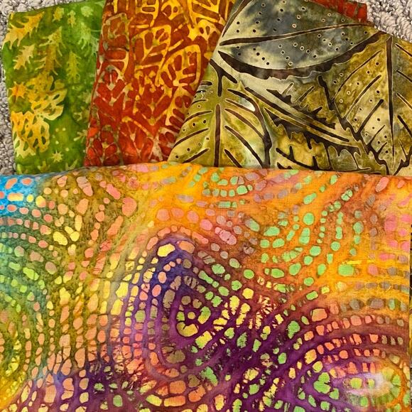 4  Batiks 1 fabric laid out is about 1/4 yd, darkest 1 1/2 and green are 1yd - Picture 2 of 6